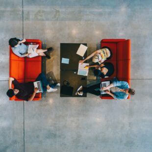 University students with books and laptop